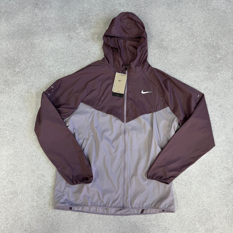 Nike Running Stride Repel jacket in burgundy and light purple